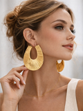 Exaggerated gold earrings