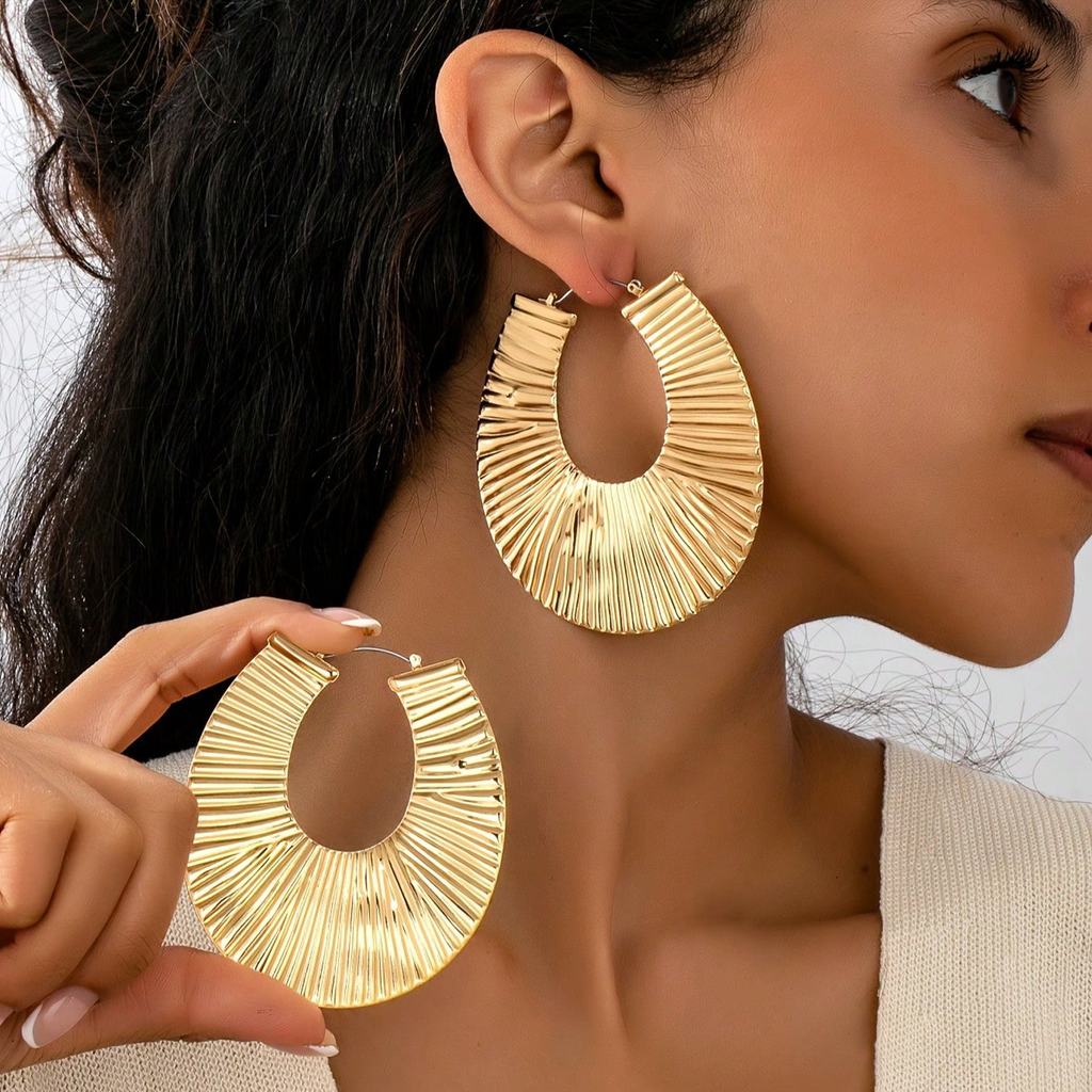 Exaggerated gold earrings