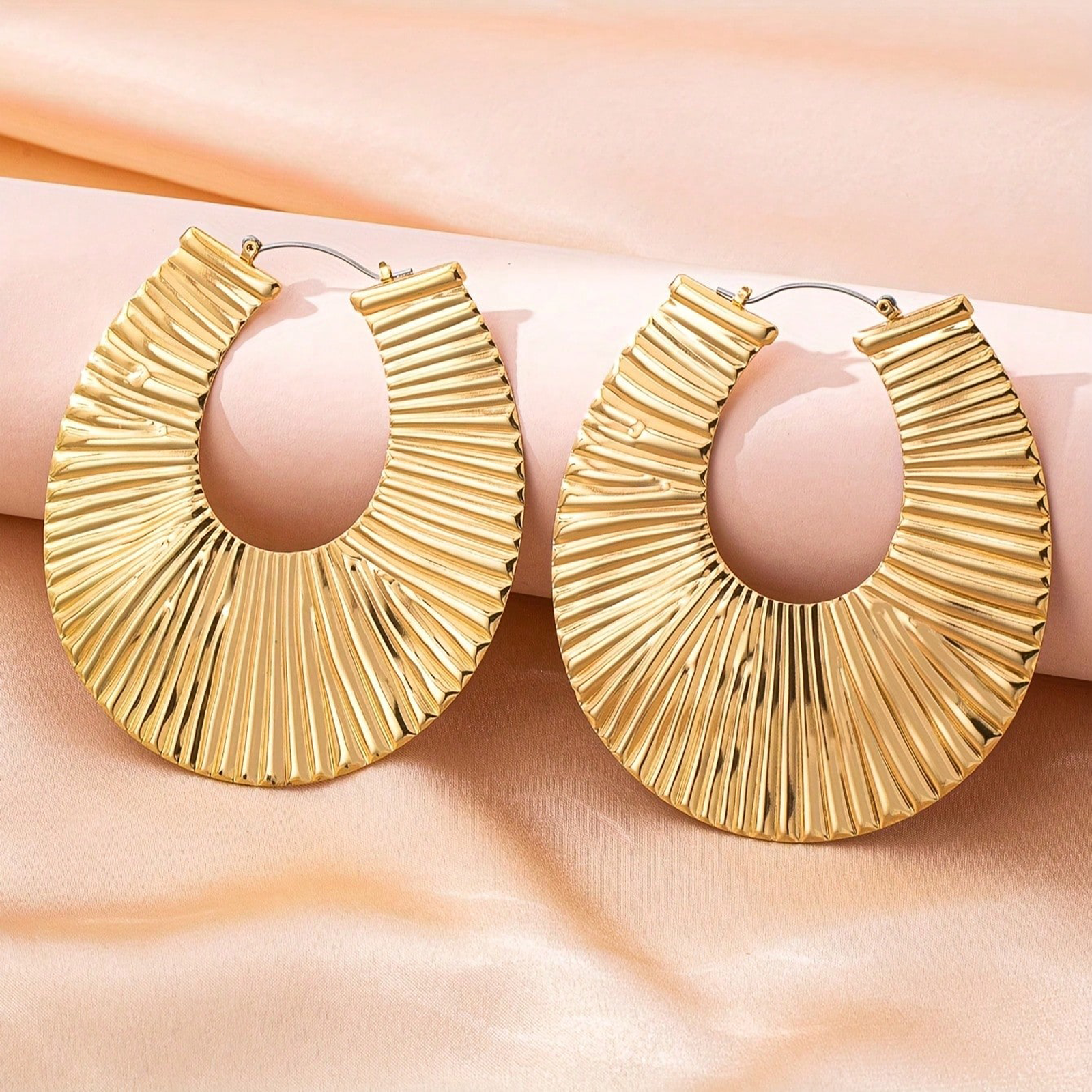 Exaggerated gold earrings