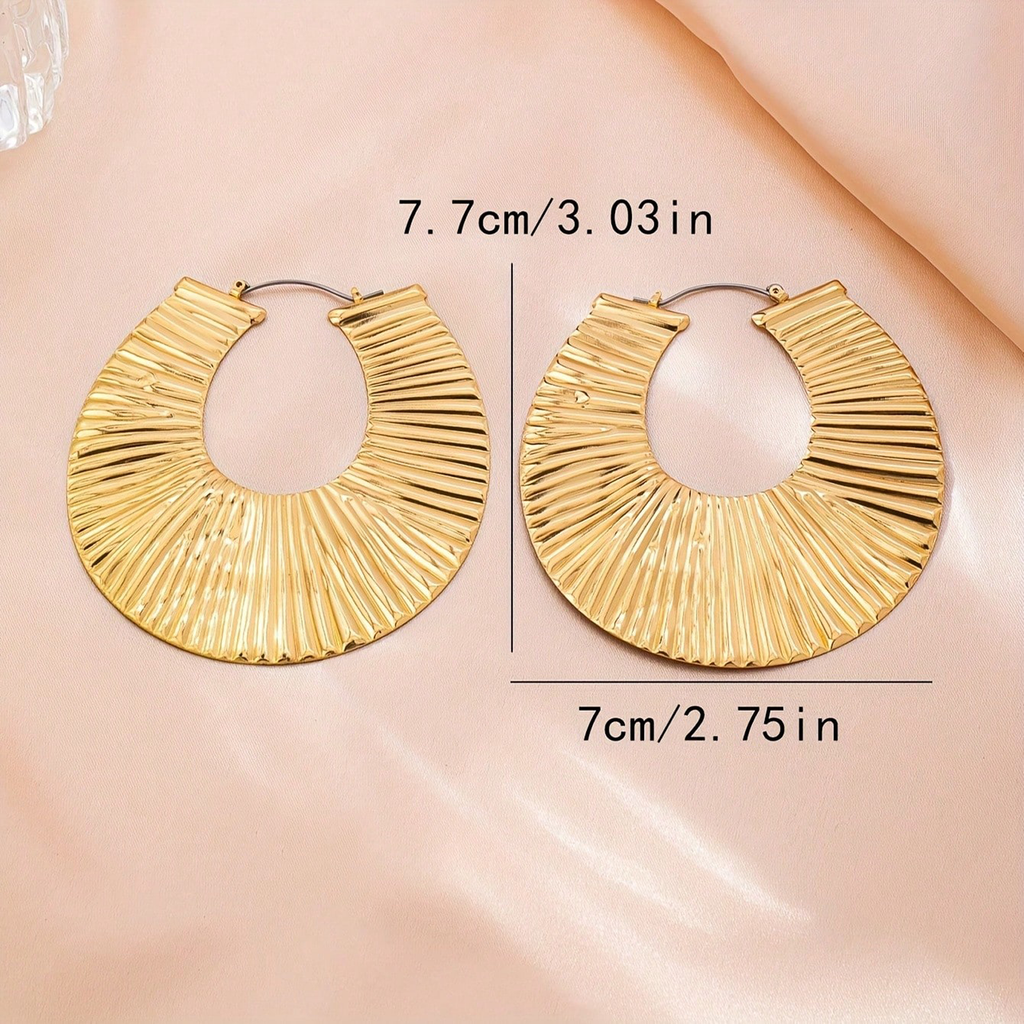 Exaggerated gold earrings