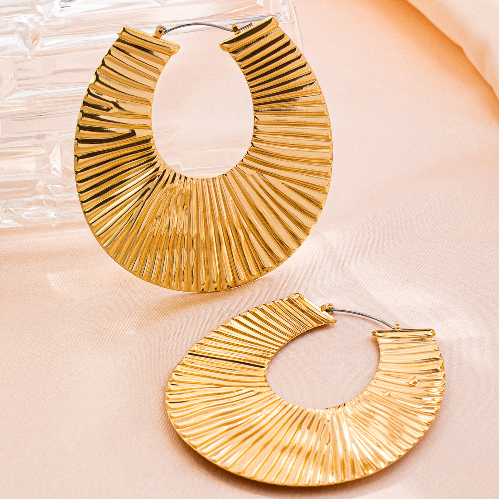 Exaggerated gold earrings